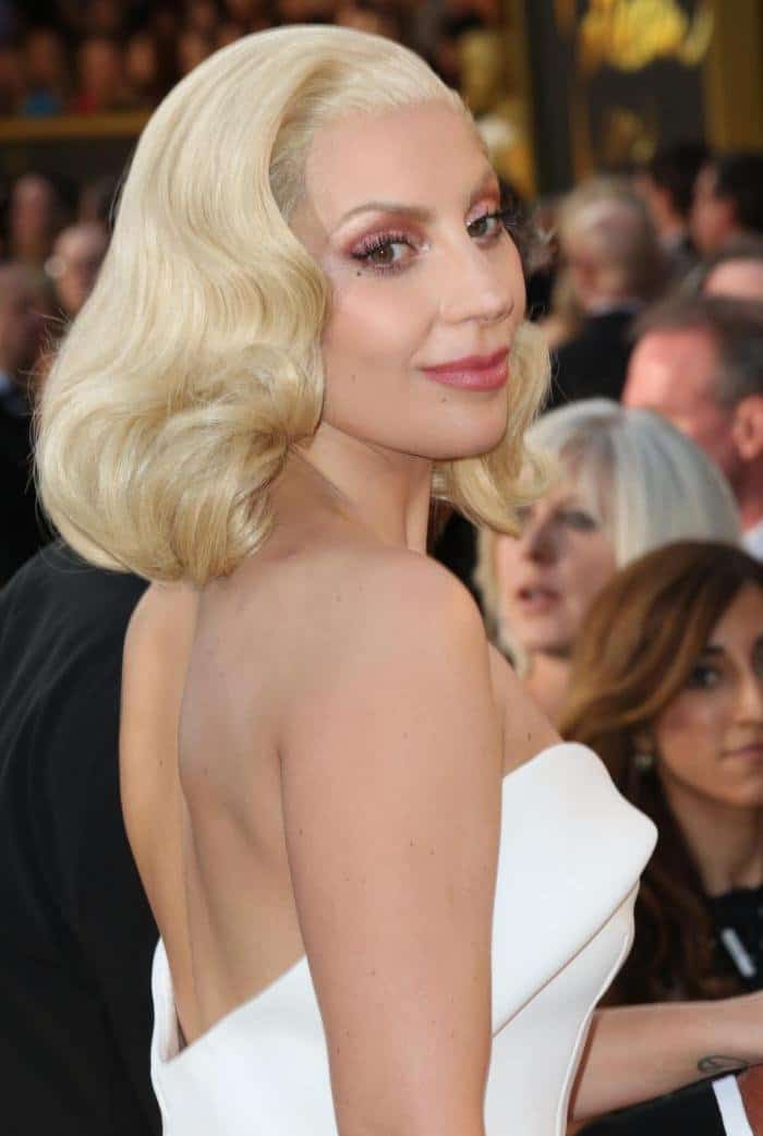 Lady Gaga completed the look with glamorous old Hollywood curls at the 88th Annual Academy Awards