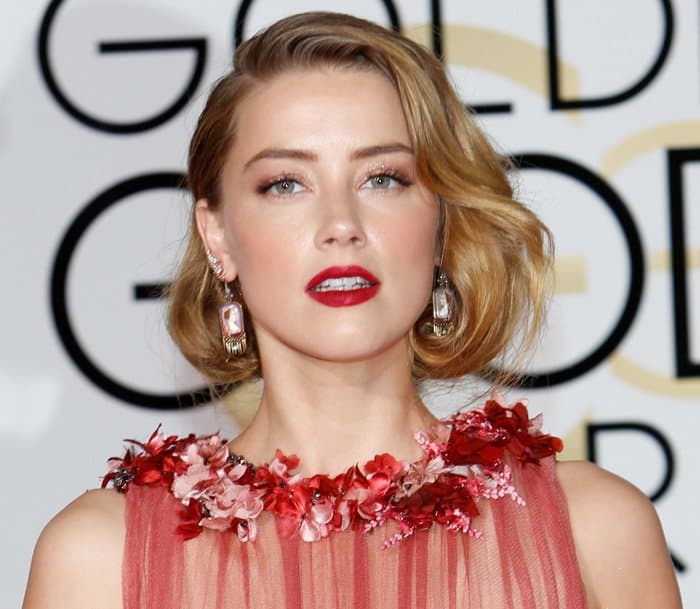 Amber Heard's elegant and classic Hollywood style was further accentuated by the deep red lipstick at the 73rd Annual Golden Globe Awards