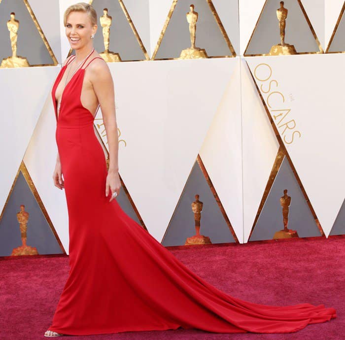Charlize Theron looked stunning in a glamorous deep-V Dior dress with a dazzling Harry Winston necklace