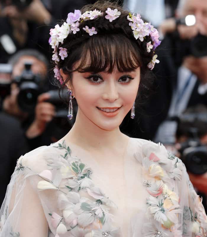 Fan Bingbing flaunts her crystal bouquet headpiece at the premiere of Mad Max: Fury Road at the 68th Annual Cannes Film Festival