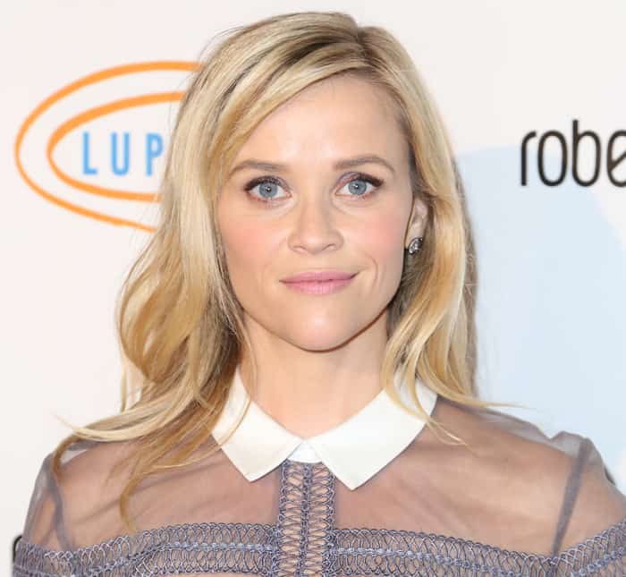 Reese Witherspoon's hair cascaded down in a side-part, and her makeup was kept light and fresh for the daytime event
