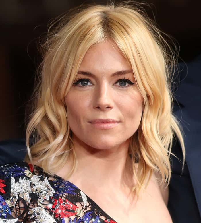 Sienna Miller's relaxed and effortless vibe was completed with tousled waves and neutral makeup at the UK Film Premiere of "Burnt"
