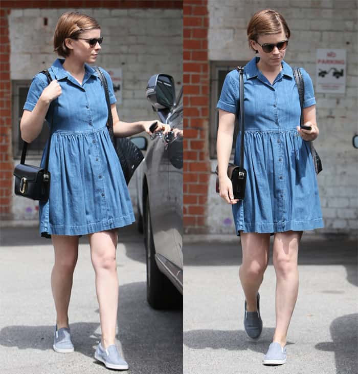 Kate Mara donned a cohesive all-jean attire featuring a relaxed shift-style dress accentuated by a pleated skirt