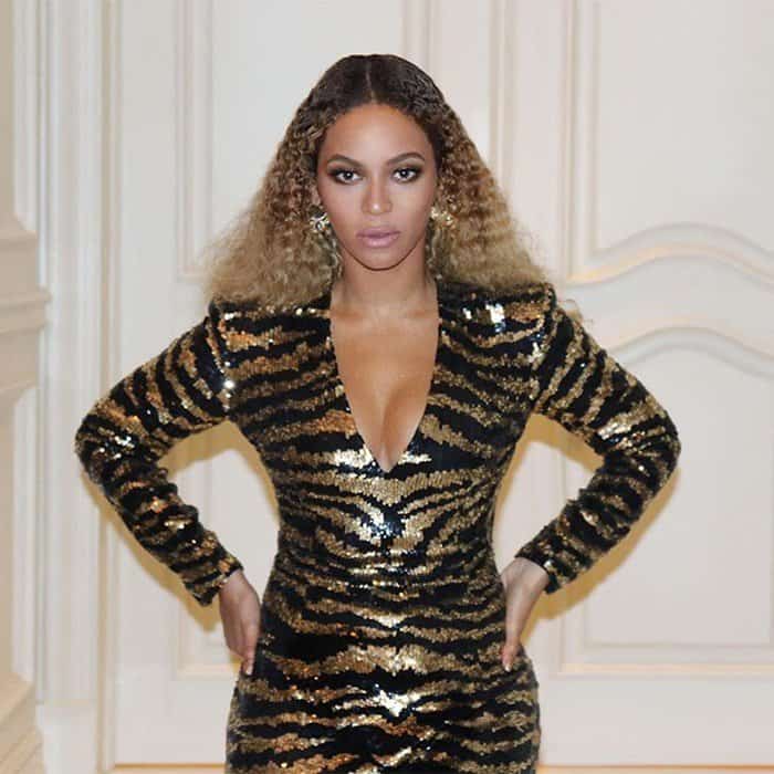 Beyonce wearing a sequined Balmain dress featuring a gold and black tiger pattern