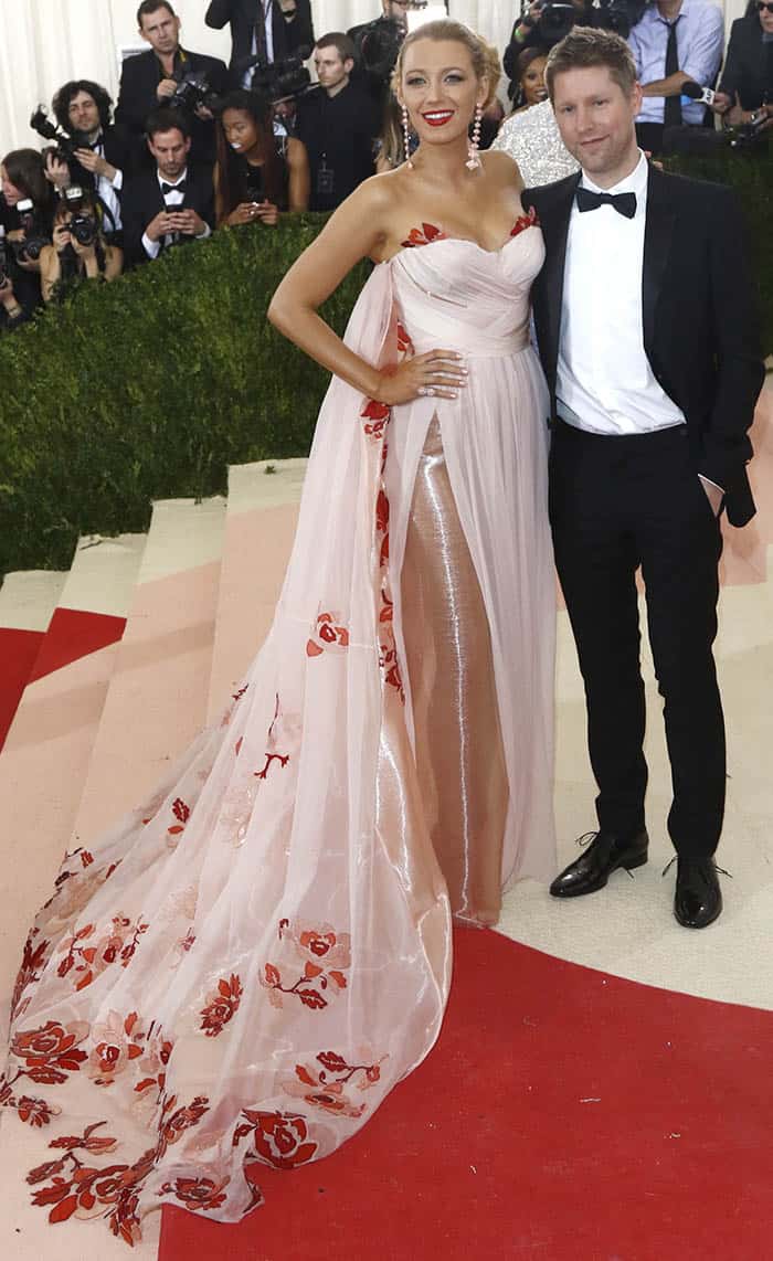 Blake Lively, in a dress featuring a corseted structure and a detachable cape adorned with intricately hand-dyed and laser-cut flower petals, was joined by Christopher Bailey attend the "Manus x Machina: Fashion in an Age of Technology" Costume Institute Gala