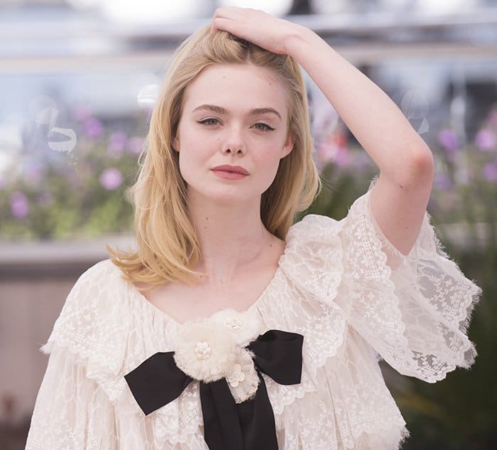 Elle Fanning's blonde locks cascaded freely down her shoulders, framing her face beautifully