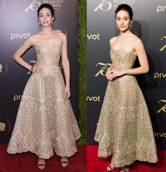 Emmy Rossum wore an intricate dress that showcased elaborate cut-out detailing, complemented by an ankle-length skirt, radiating a shimmering presence in the corset-style ensemble