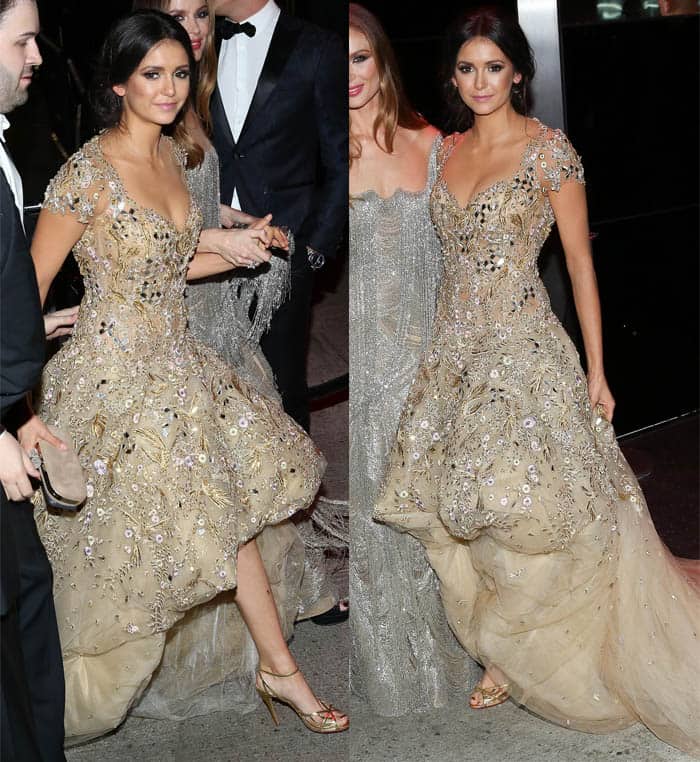 Nina Dobrev made a grand entrance at the 2016 Met Gala in a captivating gold gown that exuded a whimsical charm, perfectly in tune with the atmosphere of the annual fashion extravaganza