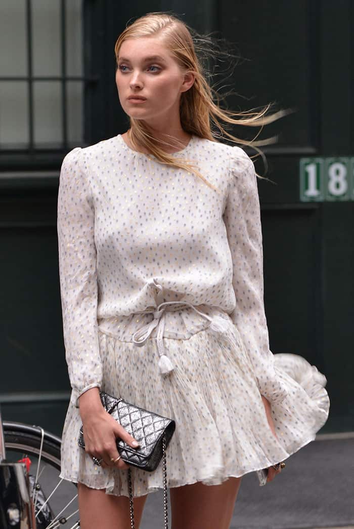 Elsa Hosk's dress featured a drawstring waistline, a pleated skirt, and elegantly long sleeves