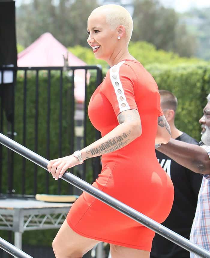 Amber Rose wearing a tight mini dress that hugged all her curves