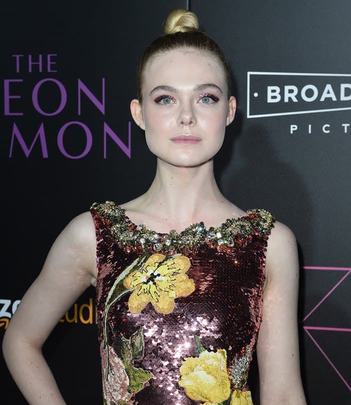 Elle Fanning's dress featured a captivating interplay of yellow and pink floral sequins, accentuated by an embellished neckline
