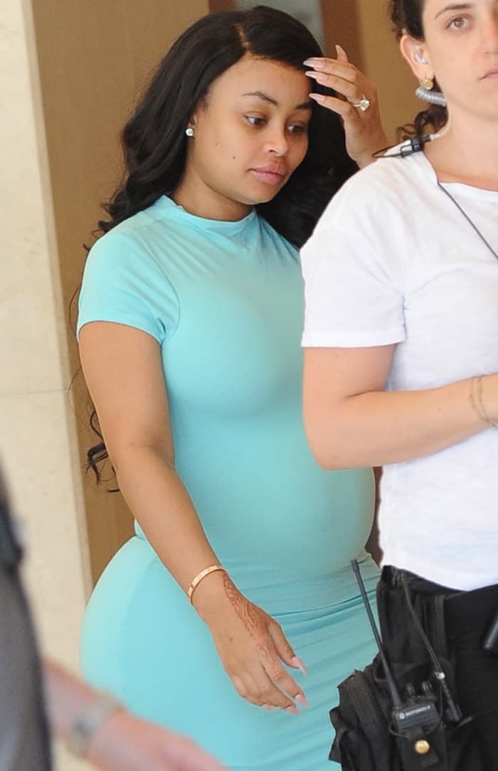 Blac Chyna shows off her baby bump in a tight green dress as she heads to Brazilian Honey Waxing in Beverly Hills on June 28, 2016