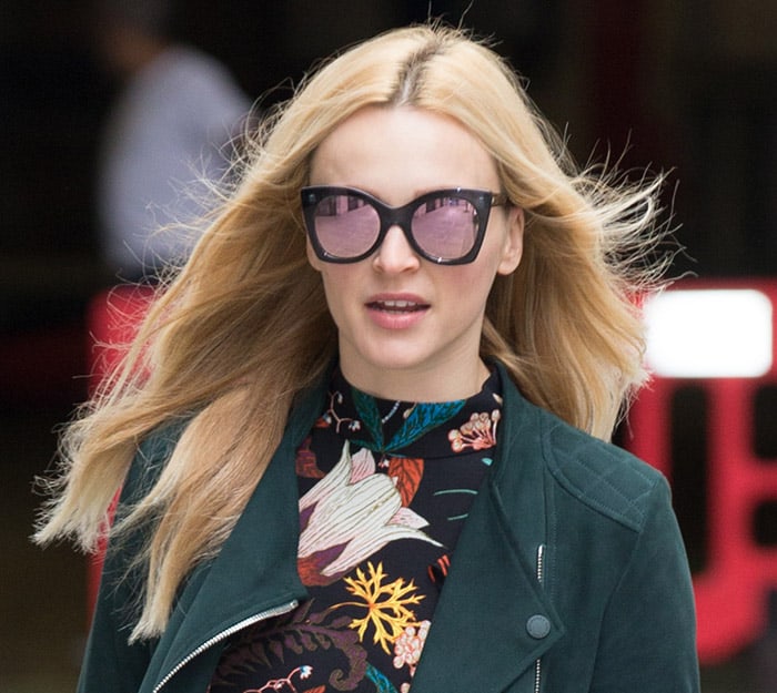 Fearne Cotton skillfully enhanced her features with a subtle blush, framed by the alluring silhouette of tinted cat-eye Le Specs shades, leaving the rest of her visage to the imagination while arriving at the BBC Radio 2 studios