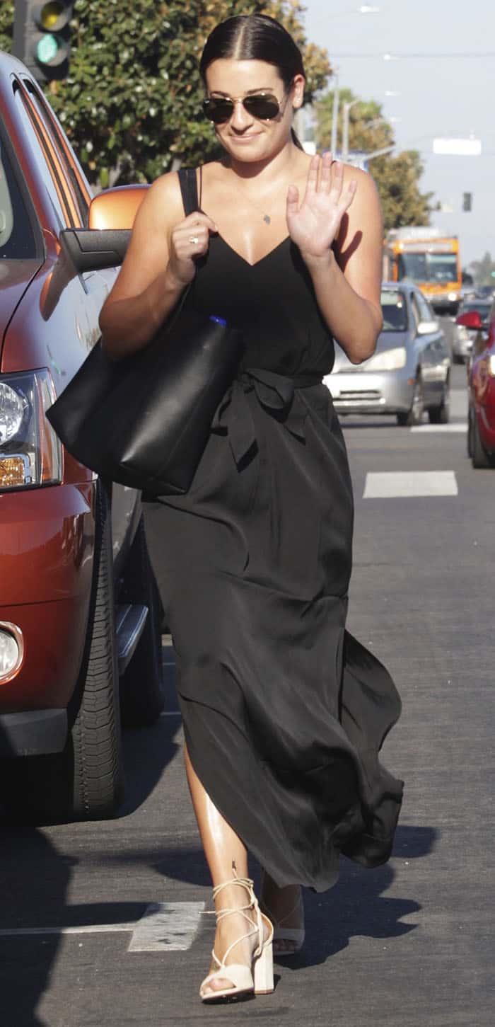 Lea Michele exemplified the timeless appeal of the long black dress, showcasing it as a fashion staple