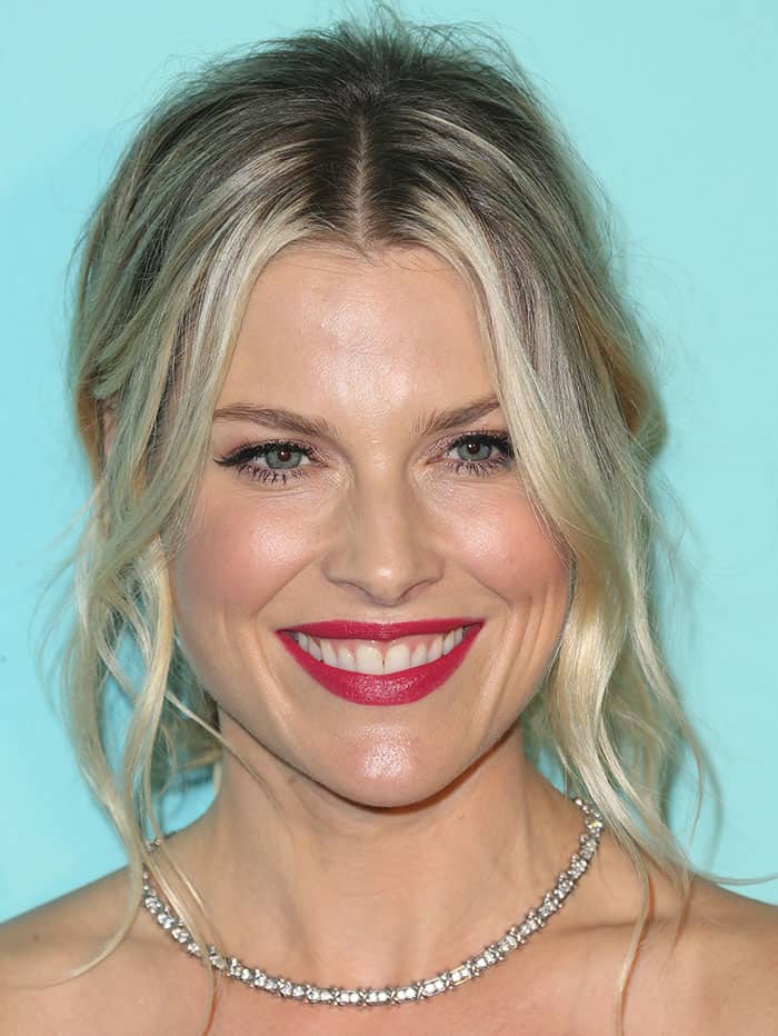 Ali Larter's choice of a bold red lip and a gracefully wavy hairstyle added the finishing touches to her look at the unveiling of the newly renovated Tiffany and Co. Beverly Hills store
