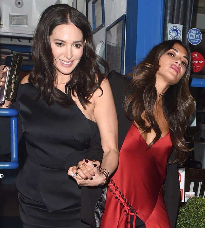 Pictured with Lauren Silverman, Nicole Scherzinger wore a chic, silky red tunic from DKNY over a pair of slim black jeans
