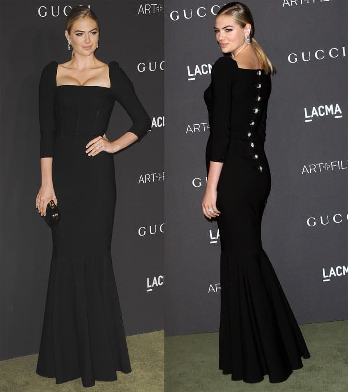 Kate Upton looked stunning in a black long-sleeved Dolce & Gabbana dress with a pleated hem and distinctive square neckline