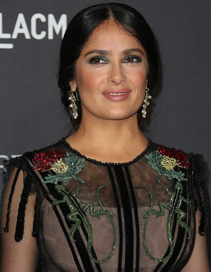 Salma Hayek's hairstyle and accessory choices further elevated her ensemble at the 2016 LACMA Art + Film Gala