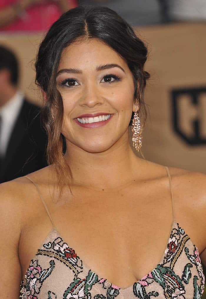 Gina Rodriguez in an embroidered dress