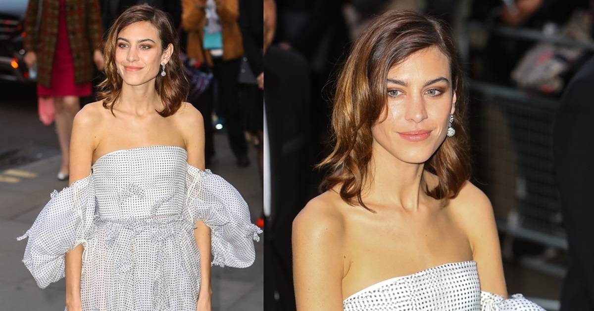 Alexa Chung Charms in Off-the-Shoulder Loewe Dress at Portrait Gala