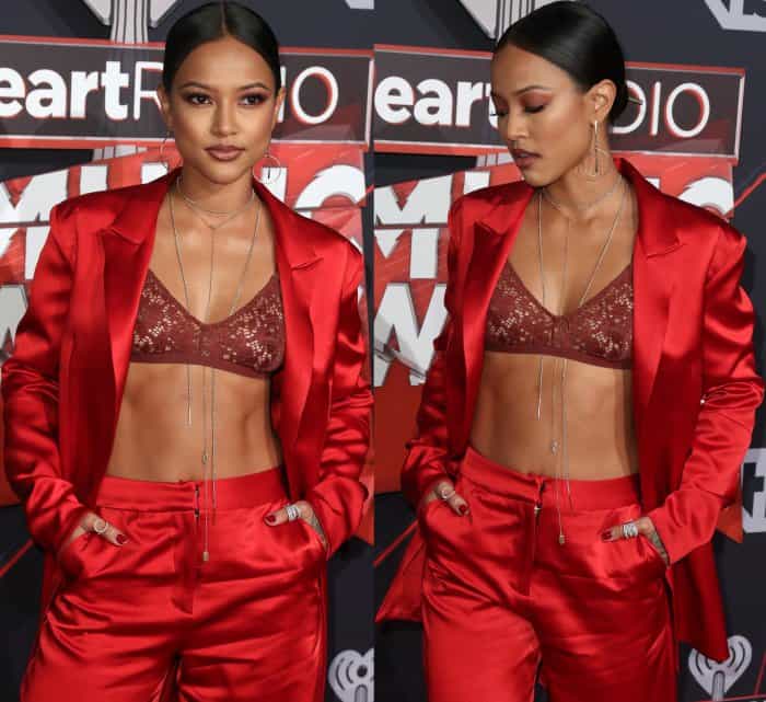 Karrueche Tran wearing a red satin Yousef Akbar two-piece suit at the 2017 iHeartRadio Music Awards