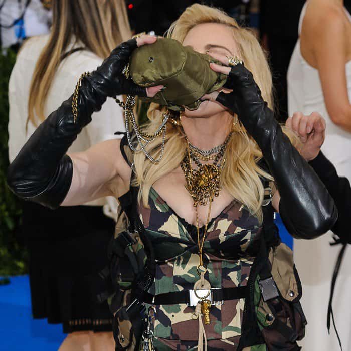 Madonna wearing a full length camouflage Moschino gown at the 2017 Met Gala in New York City on May 1, 2017