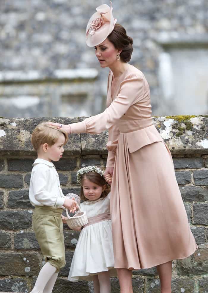 The Duchess of Cambridge dotes on Prince George and Princess Charlotte outside of the church