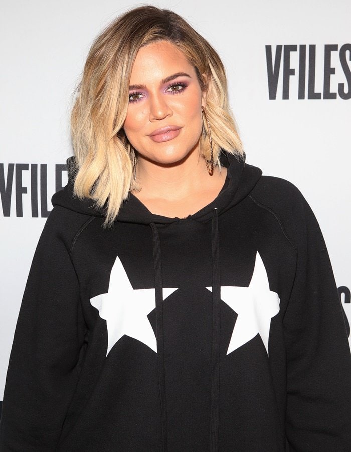 Khloe Kardashian wearing a sweatshirt dress at a fashion launch party in NY.