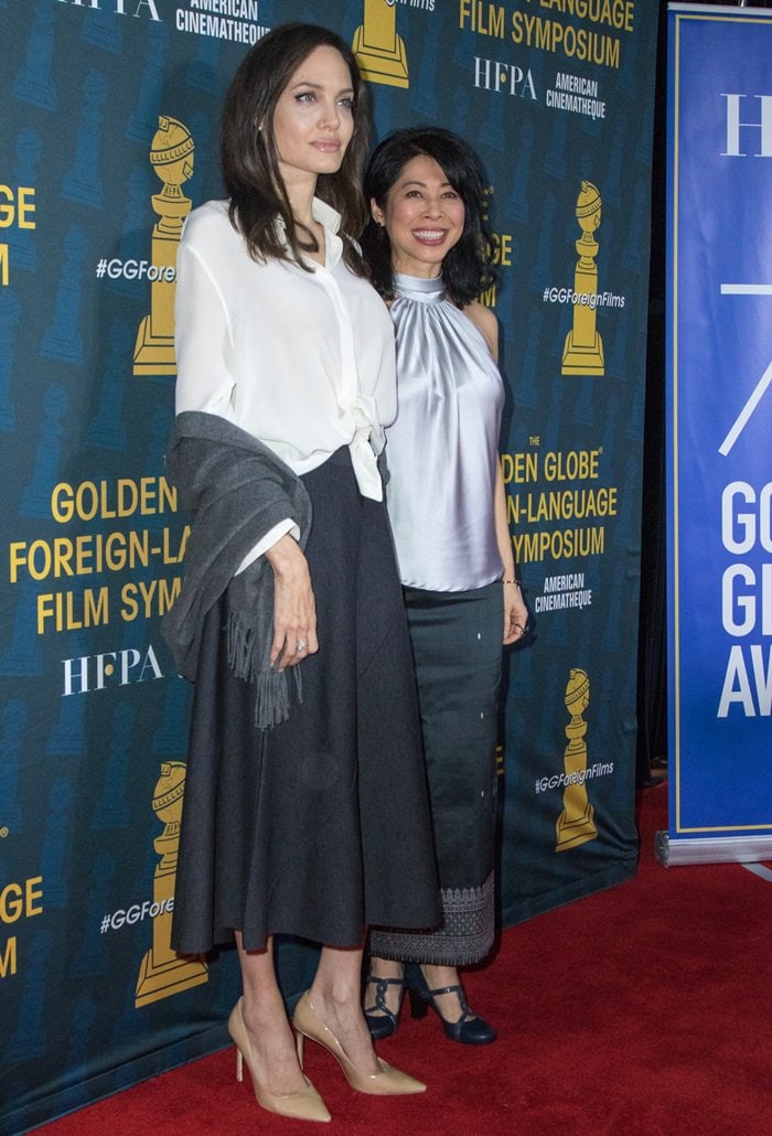 Angelina Jolie posing with Loung Ung on the red carpet while attending the HFPA and American Cinematheque’s Golden Globe Foreign Language Nominees Series Symposium at the Egyptian Theatre in Hollywood on January 6, 2018