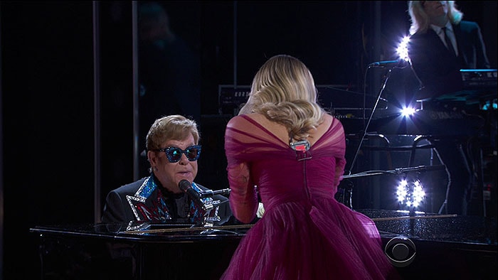 Miley Cyrus taking the stage with Sir Elton John to perform his classic hit song, 'Tiny Dancer," at the 2018 Grammy Awards held at Madison Square Garden in New York City on January 28, 2018.