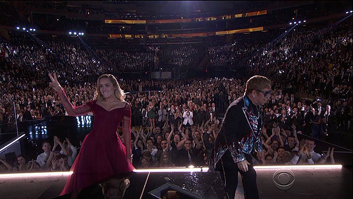 Miley Cyrus taking the stage with Sir Elton John to perform his classic hit song, 'Tiny Dancer," at the 2018 Grammy Awards held at Madison Square Garden in New York City on January 28, 2018.