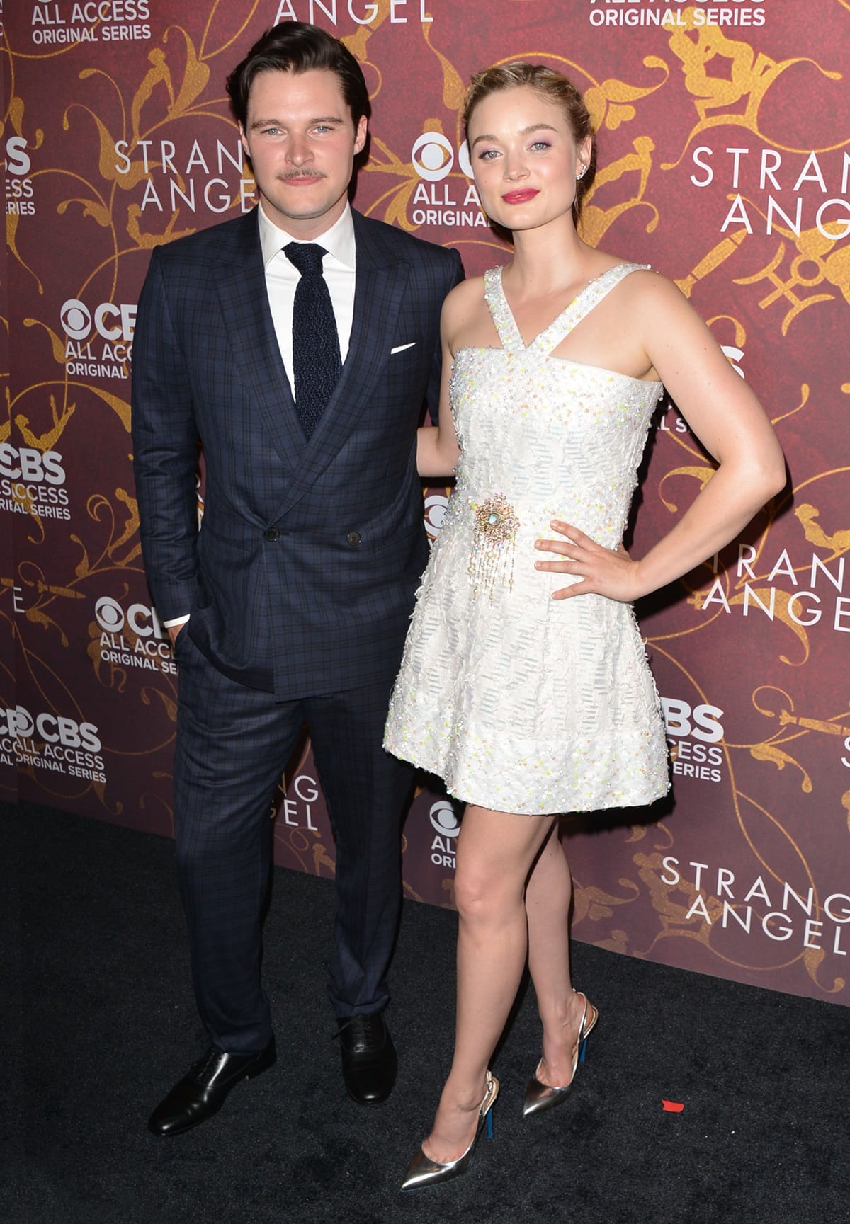At a height of 5 feet 11 inches (180.3 cm), Jack Reynor, alongside the 5 feet 6 inches (167.6 cm) tall Bella Heathcote, attended the premiere of 'Strange Angel' at Avalon
