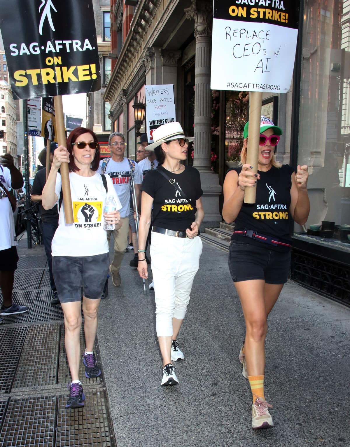 (L-R) Carrie Preston, Julianna Margulies, and Busy Philipps, all members of the Screen Actors Guild - American Federation of Television and Radio Artists (SAG-AFTRA), are seen at the SAG-AFTRA strike